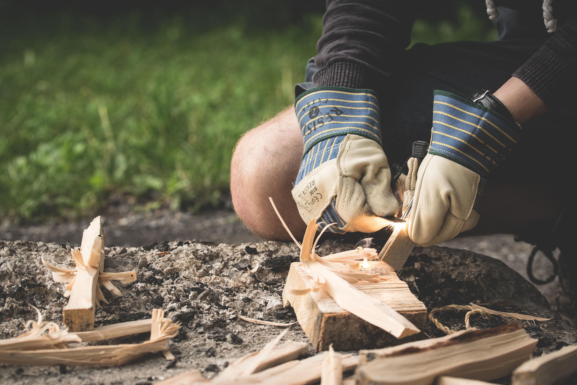 Starting a fire by hand in a bushcraft wilderness setting